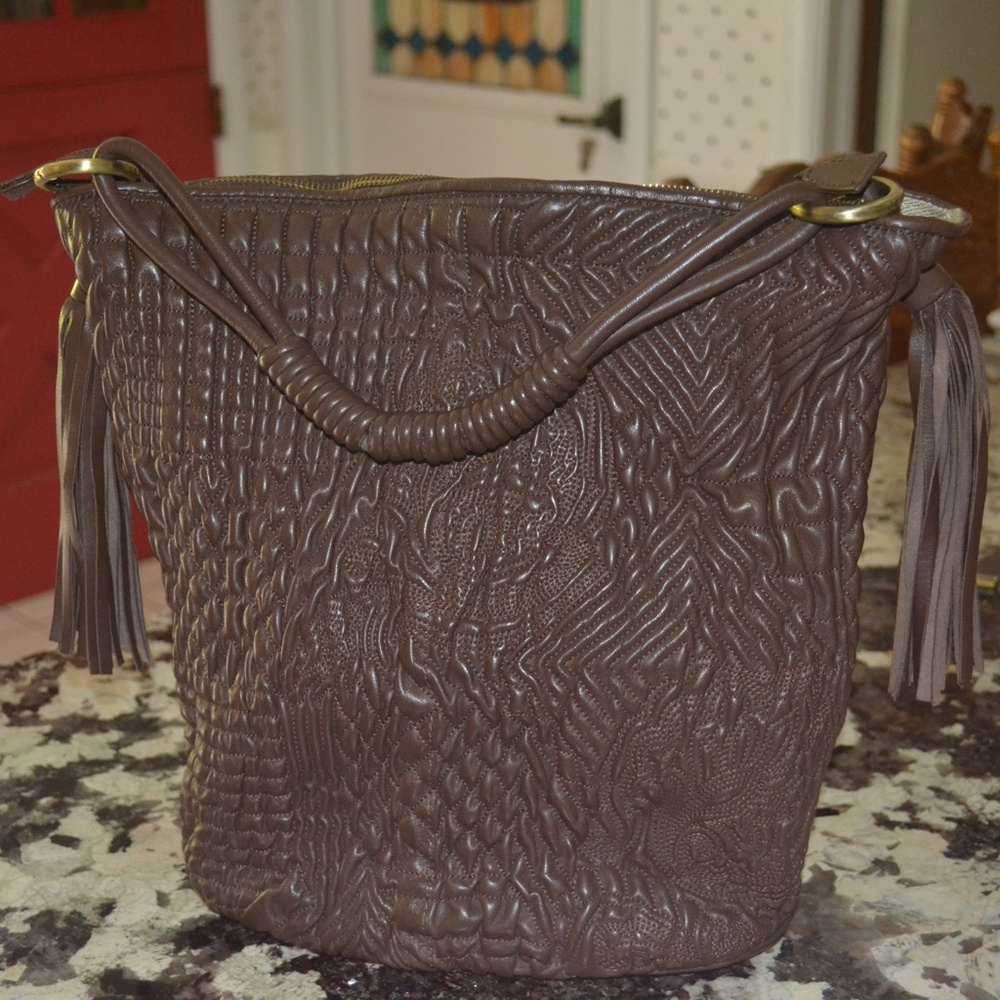 Beautifully detailed with fringe bag from Sundance.